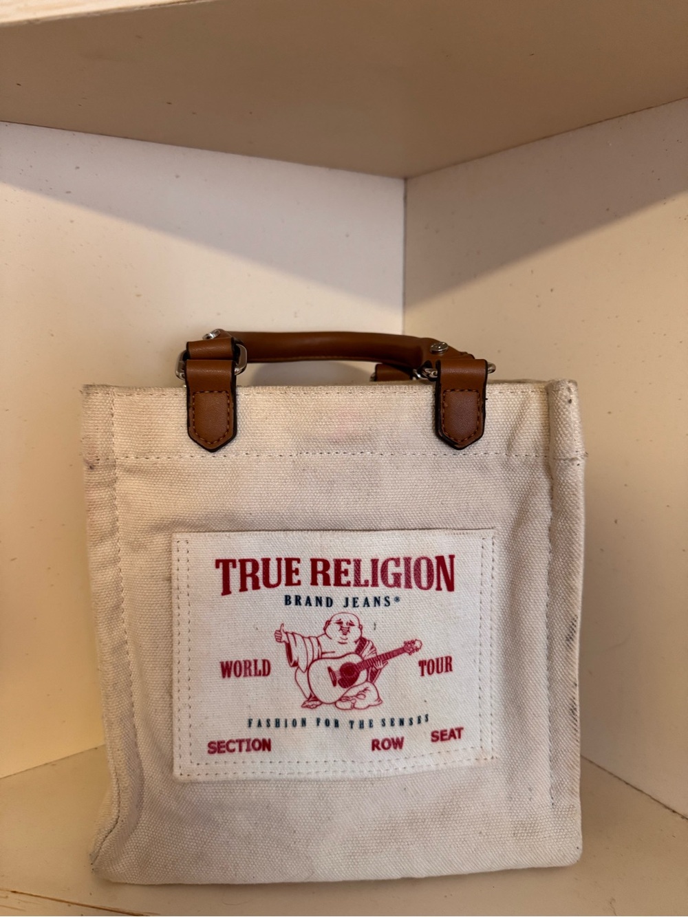 True Religion Canvas Mini Tote in Natural with Brown Handles and Red Logo